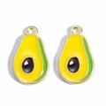 Macro shot of two gold avocado charms with green and yellow enamel for DIY jewelry - Small Avocado
