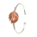 Silver wire wrapped cuff bracelet featuring a round brown goldstone tree of life charm - Silver + Goldstone