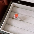 Macro shot of oval orange gemstone ring with zircon halo on black jewelry box lining - Silver Base Orange Oval Single Layer Style