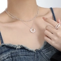 Silver layered necklace with round zircon pendant and matching ring on model - 925 Silver / Silver (Champagne Stone)