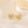 Elegant gold-tone hollow bow knot stud earrings with delicate heart-shaped cutouts - Gold