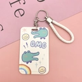 Portatessere a cartone animato con cordino intrecciato bianco e portachiavi argento - Coccodrillo OMG + Cinturino da Polso Bianco