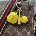 Three-piece baseball keychain with yellow glove, mini bat, and ball on a handbag - 2CM Short Bat Yellow Ball Yellow Glove