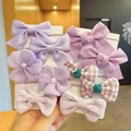 Kids elastic hair ties set featuring purple bows and floral designs on display card - Purple Green Plaid Style (0662-4)