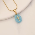 Detail of gold snake chain with blue natural stone pendant featuring a cross inlay - Blue Aventurine