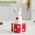 Statuetta di renna di Natale in ceramica luminosa su confezione regalo rossa - Renna in Ceramica (T1093-3)