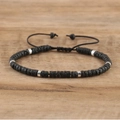 Detail of adjustable black lava stone beads bracelet with silver cylinder spacers - No.10 Lava Stone