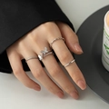 Close-up of five-piece silver ring set featuring a butterfly diamond ring on a hand model - Korean Style Butterfly Ring Set 5Pcs / Silver