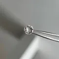 Titanium steel screw-back earring with brilliant colorful round diamond held by tweezers - 6mm Zircon White (Single Piece)