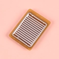 Miniature amber dollhouse BBQ grill rack with silver metal grate on pink background - 5.5cm*4cm / Brown