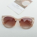 Occhiali da sole da donna cat-eye con montatura pesca trasparente e lenti sfumate - Champagne