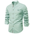 Close-up of mint green linen shirt texture with detailed blue embroidery on chest - XS / Light Green (SH291)