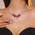 Silver bridal jewelry set with red teardrop stones and sparkling crystals on a model - Marquise Red Ruby Set / Red