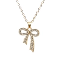 Sparkling crystal bow necklace with gold chain and pearls on a clean white background - Rhinestone Gold Bowknot (X1199)