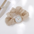 Detail view of beige fabric scrunchie watch with gold case and daisy dial pattern - Khaki
