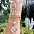 Silver butterfly suncatcher bracelet with green gemstones and celestial sun moon charms - Xiu Jade