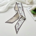 Elegant beige satin silk scarf with purple trim, featuring white floral and script patterns - Flowery Splendor Khaki