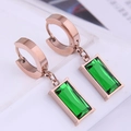 Macro detail of rose gold hoop earrings with emerald green rectangular gemstones - Rose Gold Earrings