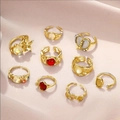 23-piece gothic skull and bat ring set in vintage gold finish on pink fabric - Retro Open Gold Ring (5832602)