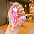 Pink honey themed keychain with dice bead pendant and silicon honey strap design - Pink Luminous Color Bean Lollipop