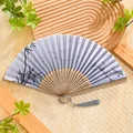 Ink bamboo pattern folding fan with hollow bamboo ribs and a grey silk tassel - 08 Silver Bamboo