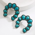 Close-up of vintage C-shaped silver earrings with turquoise teardrop stones and rhinestones - C-Shape - Turquoise