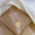 Detail of gold heart pendant with clear rhinestones on beige jewelry box setting - Titanium Steel / Gold