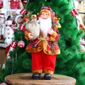 24-inch standing Santa Claus figure in red plaid outfit with gift bag for Christmas decor - Red Black Scottish Plaid / Holding Wood Sticks