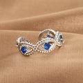 Silver adjustable evil eye ring with blue cubic zirconia on brown silk background - Minimalist Evil Eye Style (Q-J076) / White Gold