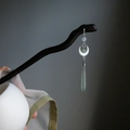 Modern floral hair pin with white crescent and green teardrop pendant on dark wood base - Ancient Sea Moon Style Hair Stick