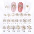 Golden alloy snowflake nail charms with white rhinestones in various designs and sizes - Hollow Snowflake Style (8650) / Gold