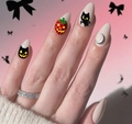 Detail of Halloween stiletto nails with black cat, moon charm, and pumpkin strawberry - Halloween Cat Pumpkin Almond Style (AW473) / Jelly Glue + Nail File