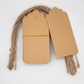 Macro shot of blank kraft paper gift tags with decorative edges and jute twine roll - 1-Kraft Scalloped Blank