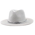 Close-up of woven jazz hat featuring decorative silver acrylic large chain links - Gray