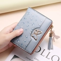 Short light blue floral wallet for women with golden butterfly and tassel detail - Blue