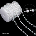 AB color 10mm and 4mm acrylic pearl bead chain with iridescent finish on black background - Faceted Ball 10mm/4mm AB Color 3 Yards