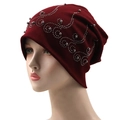 Detail of silver beads and rhinestone crown pattern on burgundy cotton slouchy beanie - 56-61cm / Burgundy