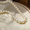 Lustrous 2mm cream white pearl choker necklace displayed on a minimal ceramic tray - 8mm White