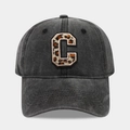 Detailed view of the leopard print letter C embroidery on a washed grey baseball cap - Leopard Alphabet C Pattern
