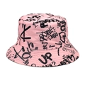 Detailed view of pink bucket hat featuring black street graffiti letter printing - Pink