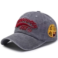 Washed grey cotton baseball cap with red Discovery embroidery in a side-profile view - Washed Grey (3ET)