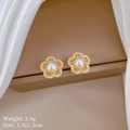 Detail of five-petal flower earrings with white pearl and pave diamonds in gold - Five-Petal Flower Pearl Stud Earrings (C138)