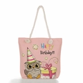 Pink canvas tote bag with cute owl birthday print and beige rope handles on white background - Happy Birthday Owl with Gift