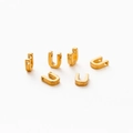 Macro detail of 6 golden vacuum plated U-shaped letter connectors for DIY jewelry - Letter U / Gold