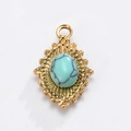 Pendaglio in turchese stile reggia francese con cornice solare dorata e sfere - Ellisse