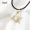 Merkabah pendant with opal gemstone and gold wire wrap on a black cord necklace - Opal
