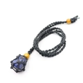 Detail of blue raw stone pendant secured in black handmade woven net with yellow beads - Blue Sodalite With Black Mesh Bag