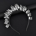 Detail of silver leaf headpiece showing intricate metal leaves on a dark background - Silver Iron Sheet Leaf