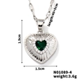 Silver heart pendant necklace with green gemstone and diamond accents on white background - Silver-Green Zirconia