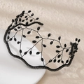 Detailed view of hand-woven black crystal beads and rhinestone crown on a white plate - Black (TS-J3244BLK)